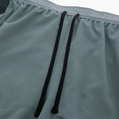 M NK DF STRIDE 5IN SHRT HYBRID